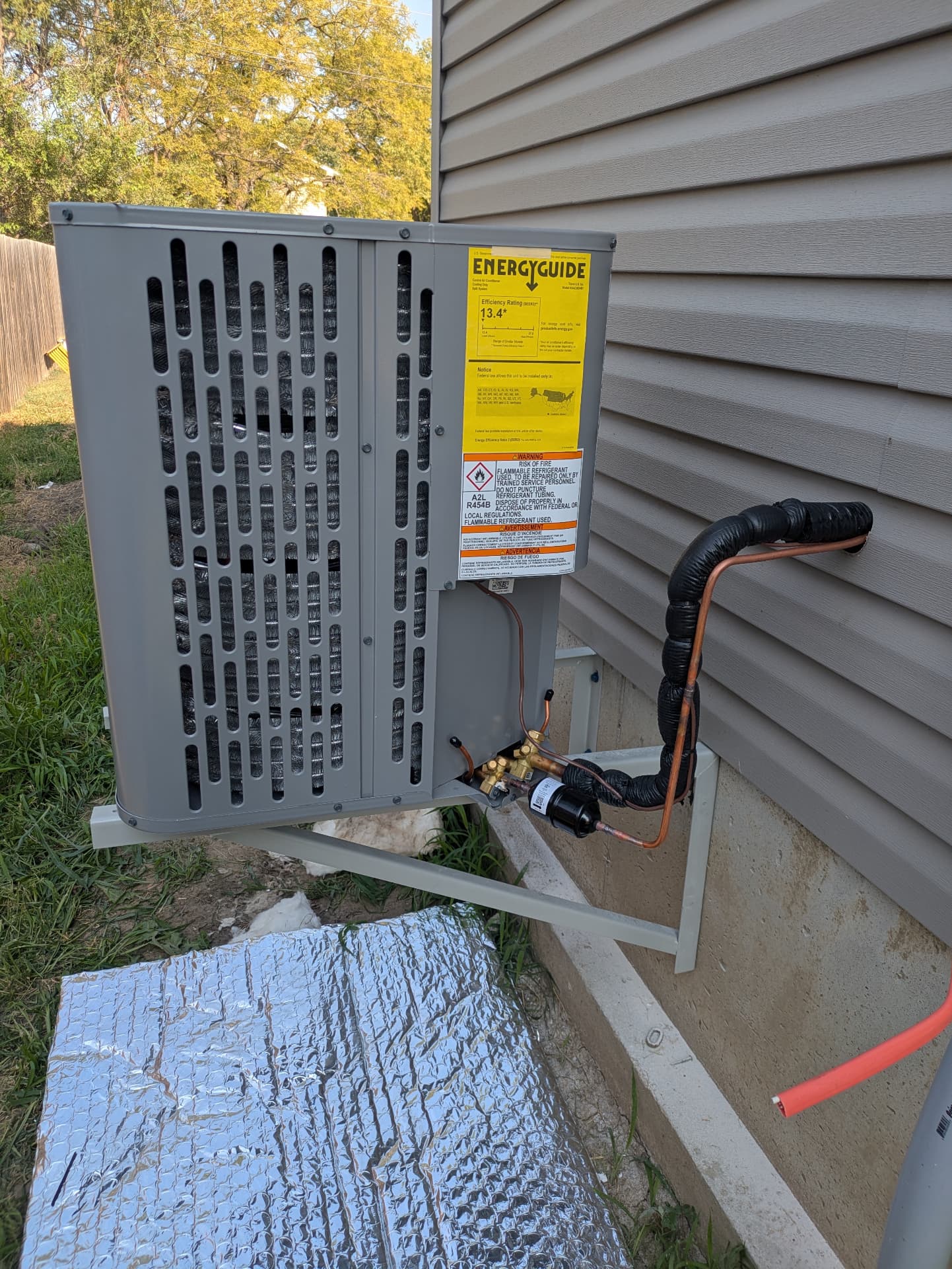 New residential heat pump mounted and connected by Bruno HVAC
